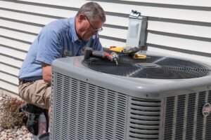 HVAC technician installing air conditioner in Edmonton, Alberta